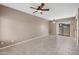Spacious living room with neutral paint, fan, and tile flooring offers a welcoming atmosphere at 2986 N Oregon St # 7, Chandler, AZ 85225
