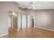 Primary bedroom features a ceiling fan, closet, laminate flooring, and ample space at 2986 N Oregon St # 7, Chandler, AZ 85225