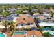Aerial view of a backyard with pool, patio, privacy fence, and well-manicured landscaping at 3021 E Harmony Cir, Mesa, AZ 85204