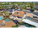 An aerial view of a home with a pool and outdoor dining at 3021 E Harmony Cir, Mesa, AZ 85204