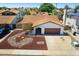 An aerial view of the front yard of the home with xeriscaping and three car driveway at 3021 E Harmony Cir, Mesa, AZ 85204