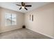 Neutral carpet and natural light make this a bright and inviting bedroom at 3021 E Harmony Cir, Mesa, AZ 85204