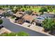 Charming single Gathering home with a two-car garage, desert landscaping and well maintained lawn at 3021 E Harmony Cir, Mesa, AZ 85204