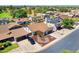 Well-maintained single-Gathering home with desert landscaping, two-car garage, and ample street parking at 3021 E Harmony Cir, Mesa, AZ 85204