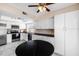 Bright kitchen features stainless steel appliances, granite countertops, and ample white cabinetry at 3021 E Harmony Cir, Mesa, AZ 85204