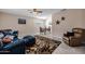 Bright living room with neutral walls, tile flooring and large windows at 3021 E Harmony Cir, Mesa, AZ 85204
