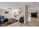 Spacious living room with tile flooring, fireplace, and neutral wall colors, providing a comfortable gathering space at 3021 E Harmony Cir, Mesa, AZ 85204