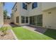 Low maintenance backyard with artificial turf, brick-paved patio and plenty of privacy at 3451 S Wren Dr, Gilbert, AZ 85297