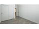 Bright bedroom featuring a closet with white sliding doors and light-colored flooring at 3451 S Wren Dr, Gilbert, AZ 85297