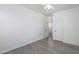 Neutral bedroom featuring light flooring, an open doorway, and an adjacent door at 3451 S Wren Dr, Gilbert, AZ 85297