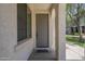 Inviting covered entryway with view of front door and desert landscape at 3451 S Wren Dr, Gilbert, AZ 85297
