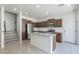 Bright kitchen with an island, stainless steel appliances, and ample cabinet space at 3451 S Wren Dr, Gilbert, AZ 85297