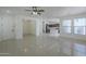 Bright, open-concept living room featuring tile flooring and modern lighting fixtures throughout at 3451 S Wren Dr, Gilbert, AZ 85297