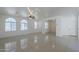Spacious living area showcasing large windows and a contemporary ceiling fan, with tile flooring at 3451 S Wren Dr, Gilbert, AZ 85297