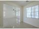 Bright and airy living room with tile flooring, recessed lighting, and ample natural light at 3451 S Wren Dr, Gilbert, AZ 85297