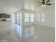 Bright living room with an open floor plan, tile floors, ceiling fan and access to the kitchen at 3451 S Wren Dr, Gilbert, AZ 85297