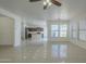 Inviting living space featuring tile floors, an open layout, and modern light fixtures and fans at 3451 S Wren Dr, Gilbert, AZ 85297