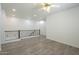 Open loft area with wood-look floors, decorative railings, and access to other rooms at 3451 S Wren Dr, Gilbert, AZ 85297