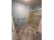 Bathroom featuring tile flooring, a glass door shower, and towel rack at 3510 E Hampton Ave # 133, Mesa, AZ 85204