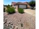 Charming single-story home with a red tile roof, low-maintenance rock garden, and a two-car garage at 3510 E Hampton Ave # 133, Mesa, AZ 85204