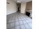 Bright living room featuring tile flooring and a cozy fireplace with a mantel at 3510 E Hampton Ave # 133, Mesa, AZ 85204