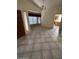 Spacious living room with vaulted ceiling, large windows, and tile flooring throughout at 3510 E Hampton Ave # 133, Mesa, AZ 85204
