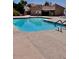 Community swimming pool with a blue railing system and clear cool blue water at 3510 E Hampton Ave # 133, Mesa, AZ 85204