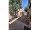 Enclosed side yard with desert landscaping featuring pavers and a small gate at 3510 E Hampton Ave # 133, Mesa, AZ 85204