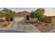 Charming single-story home featuring desert landscaping and a two-car garage at 37103 N El Morro Trl, San Tan Valley, AZ 85140