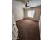 Cozy bedroom featuring neutral walls, plush carpeting, and a ceiling fan with light fixture at 3853 W Calle Lejos --, Glendale, AZ 85310