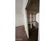 Bedroom closet featuring sliding doors, custom shelving, and carpet flooring at 3853 W Calle Lejos --, Glendale, AZ 85310