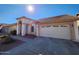 Charming single-story home featuring a well-maintained front yard and a two-car garage on a sunny day at 3853 W Calle Lejos --, Glendale, AZ 85310
