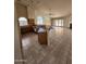 Open-concept kitchen with granite countertops, tile flooring, breakfast bar, and stainless steel appliances at 3853 W Calle Lejos --, Glendale, AZ 85310