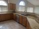 Kitchen featuring granite countertops, stainless steel appliances, and light wood cabinets with large windows at 3853 W Calle Lejos --, Glendale, AZ 85310