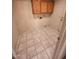 Functional laundry room with tiled flooring, wall-mounted cabinets, and a utility sink at 3853 W Calle Lejos --, Glendale, AZ 85310