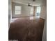 Living room featuring carpet flooring, bright windows with blinds, and a ceiling fan at 3853 W Calle Lejos --, Glendale, AZ 85310