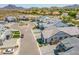 Panoramic aerial view of a residential community showcasing modern homes, landscaping, and paved streets at 3915 N Shannon Cir, Mesa, AZ 85215