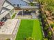 An aerial view of a cozy backyard with a putting green, outdoor kitchen, and patio, made for entertaining and relaxing at 3915 N Shannon Cir, Mesa, AZ 85215