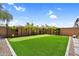 Scenic backyard featuring a putting green, tasteful landscaping, and peaceful retreat with desert accents at 3915 N Shannon Cir, Mesa, AZ 85215