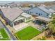 Aerial view of backyard oasis, complete with a putting green, covered patio, and outdoor seating, perfect for entertaining at 3915 N Shannon Cir, Mesa, AZ 85215