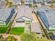 Aerial view of a private backyard featuring a putting green, patio, and covered outdoor kitchen, ideal for relaxation at 3915 N Shannon Cir, Mesa, AZ 85215