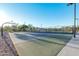 The basketball court sits adjacent to the tennis court, offering recreational opportunities for an active lifestyle at 3915 N Shannon Cir, Mesa, AZ 85215