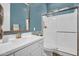 Bathroom with a shower, brushed gold hardware and blue painted walls at 3915 N Shannon Cir, Mesa, AZ 85215