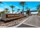 A Primary-planned community entrance with native vegetation and a decorative brick wall sets the tone at 3915 N Shannon Cir, Mesa, AZ 85215