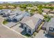Stunning aerial view of a modern home with a paved driveway and manicured front yard, showcasing elegance and curb appeal at 3915 N Shannon Cir, Mesa, AZ 85215