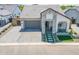 Beautiful home featuring a well-manicured front yard and a paved driveway, creating a warm and inviting curb appeal at 3915 N Shannon Cir, Mesa, AZ 85215