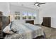 Close-up of main bedroom featuring natural light, a ceiling fan, and wood-look tile floors at 3915 N Shannon Cir, Mesa, AZ 85215