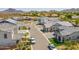 Scenic neighborhood street view with well-maintained homes and mountain backdrop, offering a serene desert living experience at 3915 N Shannon Cir, Mesa, AZ 85215