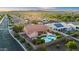 An aerial view of a beautiful home featuring a private pool, spa, and outdoor living space at 4029 N 160Th Dr, Goodyear, AZ 85395
