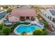Aerial view of a home showcasing a pool, hot tub, putting green, and patio at 4029 N 160Th Dr, Goodyear, AZ 85395